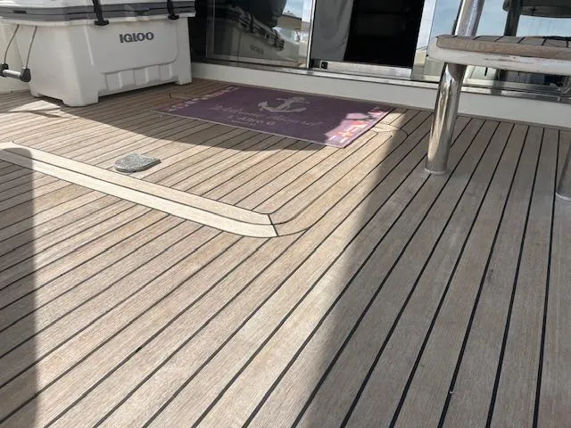 L Altro G Yacht Photos Pics Teak deck of 2006 Cranchi Atlantique 48 yacht with Igloo cooler.