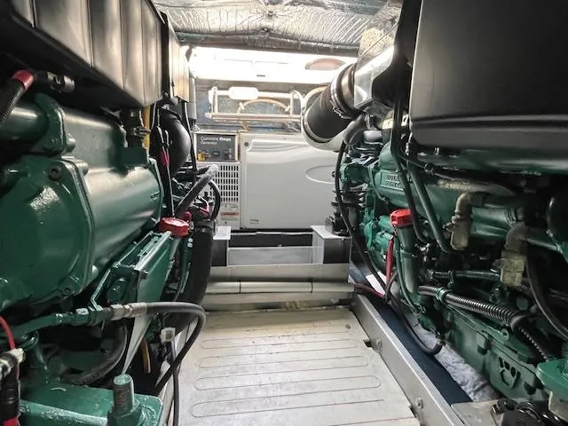 L Altro G Yacht Photos Pics Engine room of 2006 Cranchi Atlantique 48 yacht, showcasing dual engines and mechanical components.