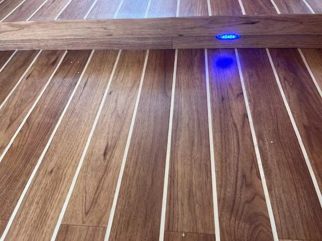 L Altro G Yacht Photos Pics Teak flooring with blue LED light on 2006 Cranchi Atlantique 48 yacht.