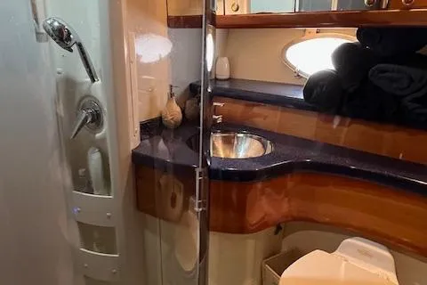 L Altro G Yacht Photos Pics Luxurious bathroom in 2006 Cranchi Atlantique 48 yacht with modern fixtures and elegant design.