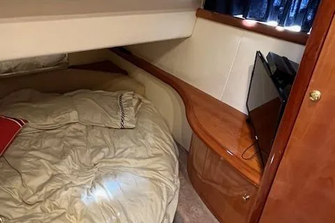 L Altro G Yacht Photos Pics Cozy cabin interior of 2006 Cranchi Atlantique 48 yacht with bed and TV.
