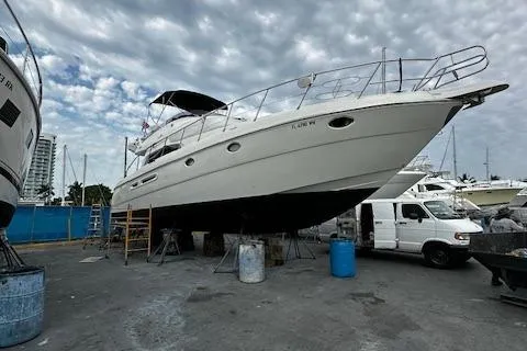 L Altro G Yacht Photos Pics 2006 Cranchi Atlantique 48 yacht on dry dock with overcast sky.