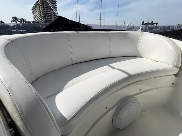L Altro G Yacht Photos Pics White leather seating on 2006 Cranchi Atlantique 48 yacht, with cityscape background.