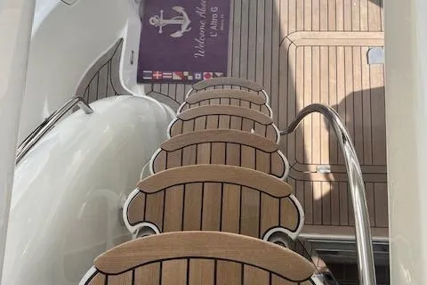 L Altro G Yacht Photos Pics Staircase on 2006 Cranchi Atlantique 48 yacht with wooden deck and welcome mat.