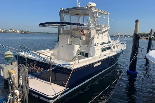  Yacht Photos Pics 2002 Albin 32 + 2 Command Bridge boat docked in a marina.