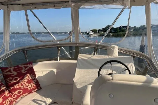  Yacht Photos Pics 2002 Albin 32 + 2 Command Bridge interior with scenic water view and comfortable seating.