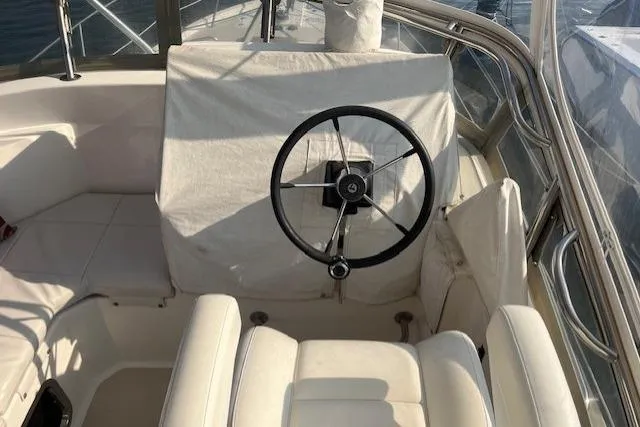  Yacht Photos Pics 2002 Albin 32 + 2 Command Bridge helm with covered steering wheel and seating.