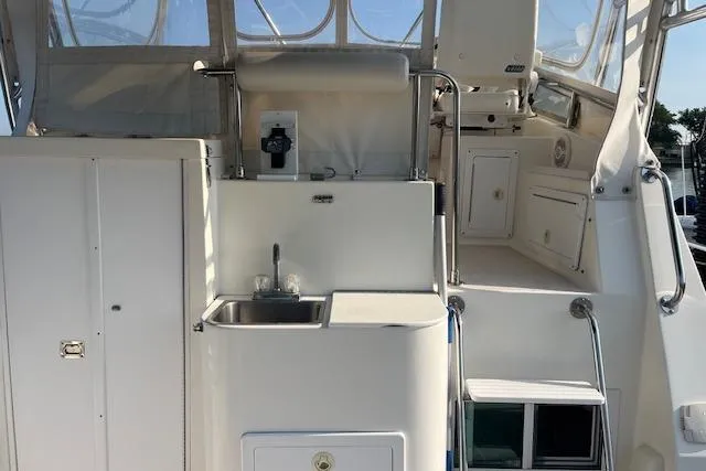  Yacht Photos Pics 2002 Albin 32 + 2 Command Bridge interior with sink and storage compartments.