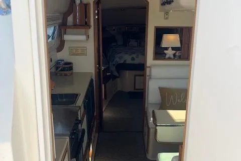  Yacht Photos Pics Interior of 2002 Albin 32 + 2 Command Bridge, featuring cozy cabin and kitchenette.