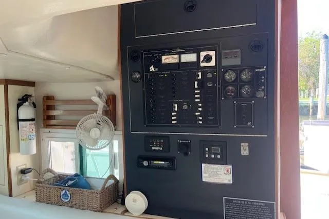  Yacht Photos Pics Control panel of a 2002 Albin 32 + 2 Command Bridge with fan and fire extinguisher.