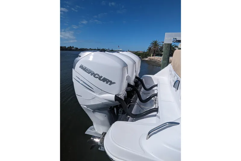 'why Knot' Yacht Photos Pics 2008 Donzi 38 ZSF boat with Mercury outboard engines on a sunny day.