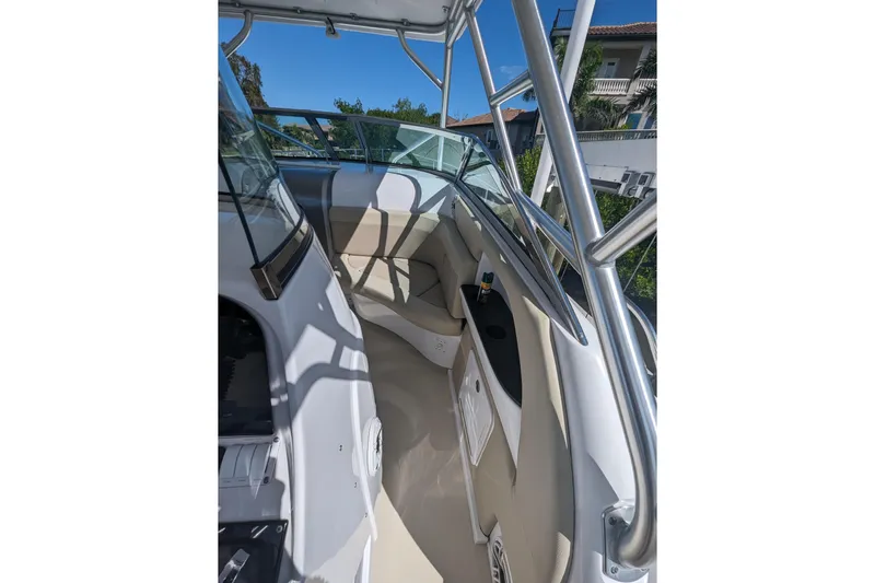 'why Knot' Yacht Photos Pics 2008 Donzi 38 ZSF boat interior with seating and railing, under clear blue sky.