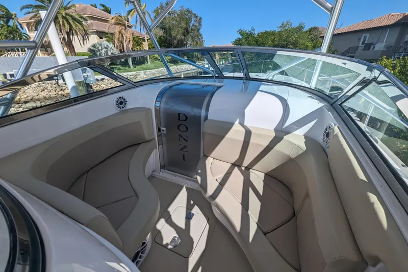 'why Knot' Yacht Photos Pics 2008 Donzi 38 ZSF boat interior with beige seating and sleek design.