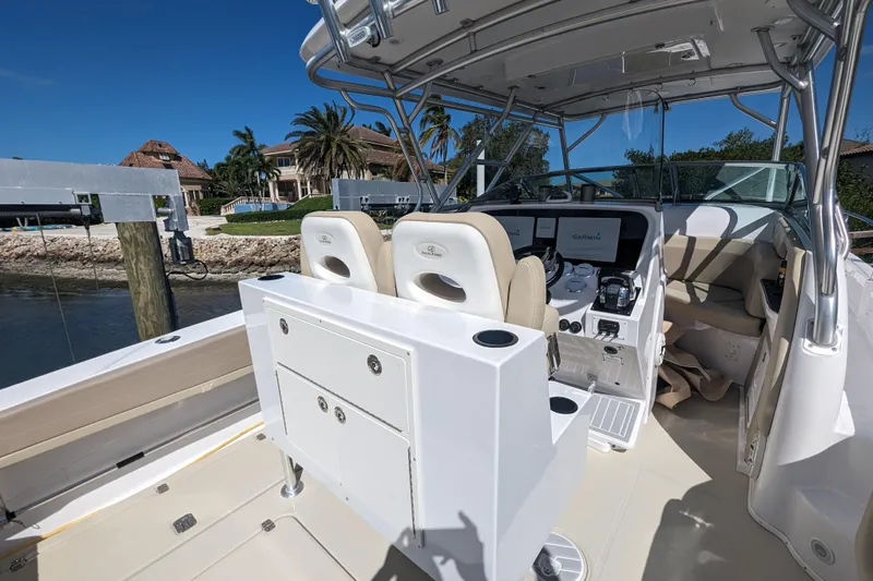 'why Knot' Yacht Photos Pics 2008 Donzi 38 ZSF boat interior with helm, seating, and navigation equipment.