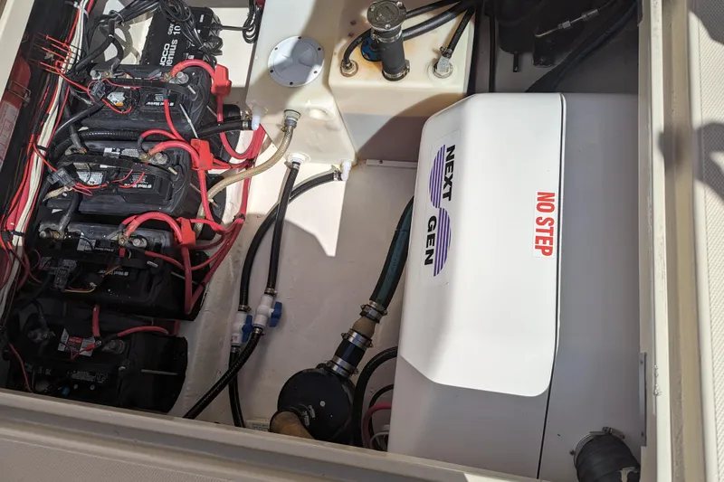 'why Knot' Yacht Photos Pics Engine compartment of a 2008 Donzi 38 ZSF with batteries and generator.