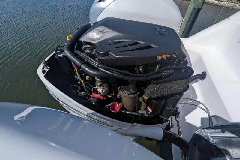 'why Knot' Yacht Photos Pics 2008 Donzi 38 ZSF boat engine, detailed view, docked on water.