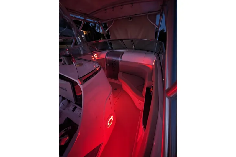 'why Knot' Yacht Photos Pics 2008 Donzi 38 ZSF boat interior with red ambient lighting at night.