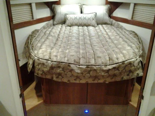  Yacht Photos Pics 2017 Formula 40 Performance Cruiser cabin with luxurious bedding and wood accents.