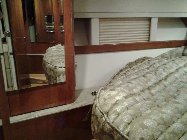  Yacht Photos Pics Interior of 2017 Formula 40 Performance Cruiser with elegant bedding and wood accents.