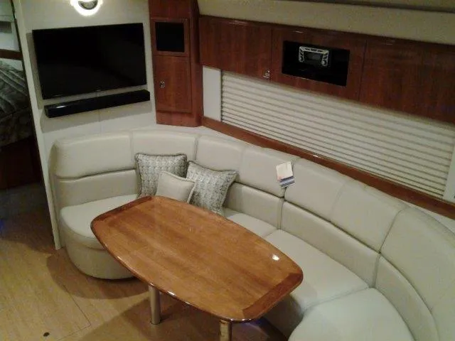  Yacht Photos Pics Luxurious interior of 2017 Formula 40 Performance Cruiser with plush seating and wooden table.