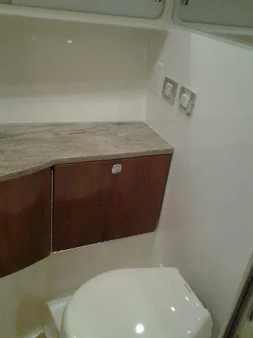  Yacht Photos Pics 2017 Formula 40 Performance Cruiser bathroom with wooden cabinets and modern fixtures.