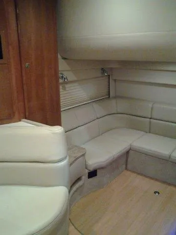  Yacht Photos Pics 2017 Formula 40 Performance Cruiser interior with beige seating and wood accents.