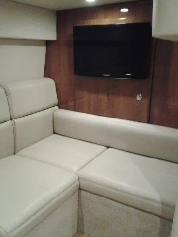  Yacht Photos Pics 2017 Formula 40 Performance Cruiser interior with beige seating and wall-mounted TV.