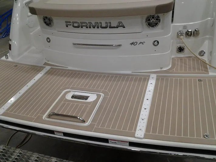  Yacht Photos Pics 2017 Formula 40 Performance Cruiser, rear deck view with branded logo and teak flooring.