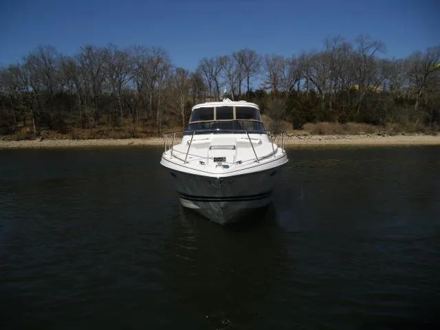  Yacht Photos Pics 2017 Formula 40 Performance Cruiser on calm water, with wooded shoreline in background.