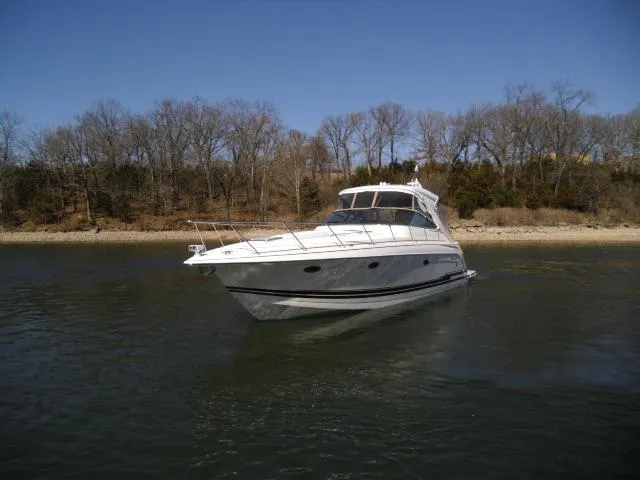  Yacht Photos Pics 2017 Formula 40 Performance Cruiser on calm water, with trees in the background.