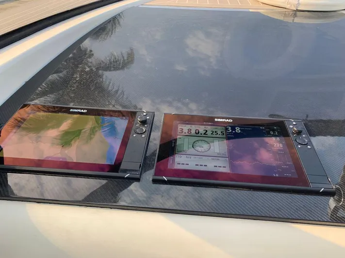 Geminis Yacht Photos Pics VanDutch 55 2014 boat dashboard with Simrad navigation screens.