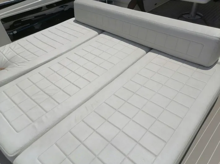 Geminis Yacht Photos Pics White cushioned seating on a 2014 VanDutch 55 yacht.