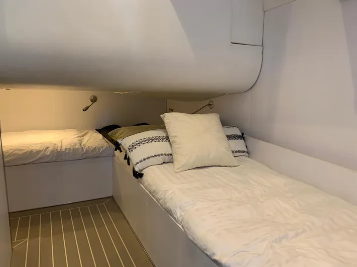 Geminis Yacht Photos Pics Interior cabin of 2014 VanDutch 55 yacht with twin beds and modern lighting.