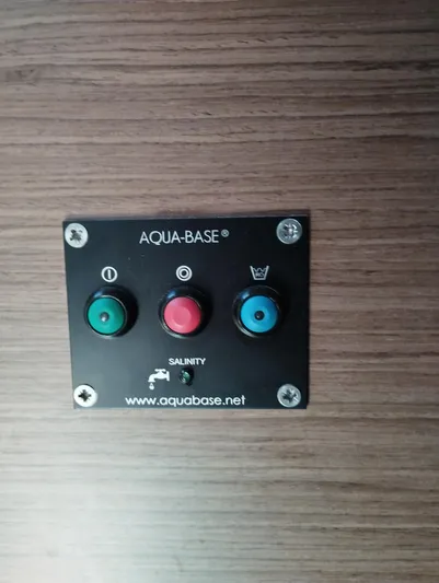Alma De Sur Yacht Photos Pics Control panel on Lagoon 46 yacht, featuring Aqua-Base buttons for salinity management.