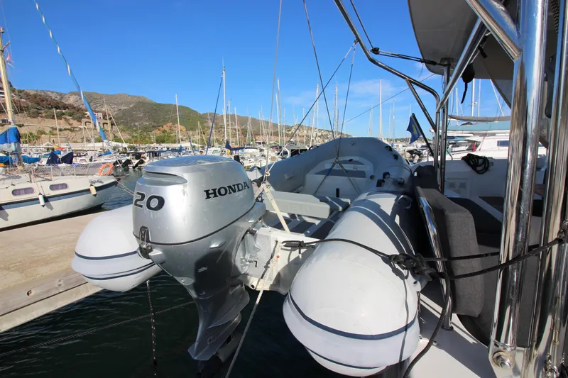 Alma De Sur Yacht Photos Pics Lagoon 46 catamaran with Honda outboard motor, docked in a marina, 2021 model.