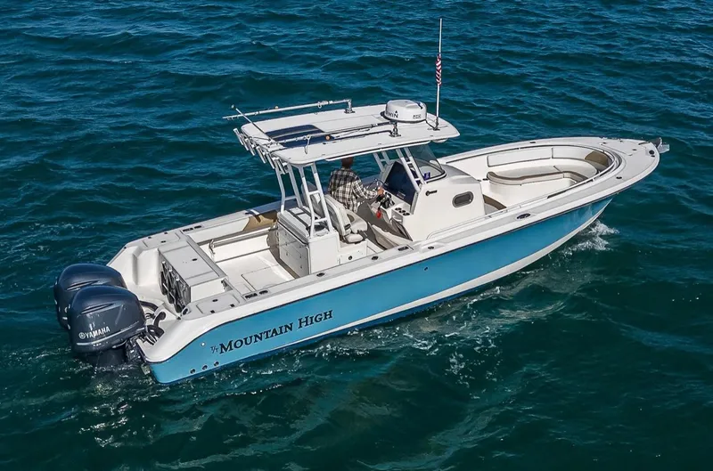  Yacht Photos Pics 2015 Edgewater 320CC boat cruising on open water, featuring dual Yamaha engines.