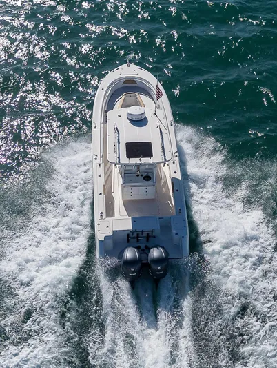  Yacht Photos Pics Aerial view of 2015 Edgewater 320CC boat cruising on open water.