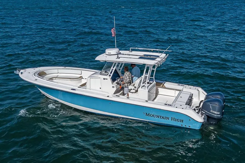  Yacht Photos Pics 2015 Edgewater 320CC boat on ocean, featuring "Mountain High" name and Yamaha engines.