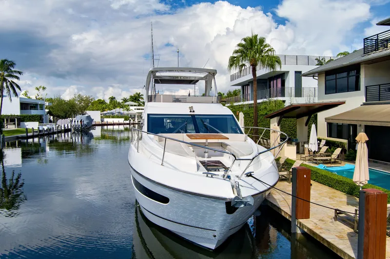Joie De Vivre Yacht Photos Pics Luxurious 2020 Sunseeker Manhattan 52 yacht docked by waterfront homes.