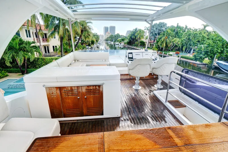 Joie De Vivre Yacht Photos Pics Luxurious 2020 Sunseeker Manhattan 52 yacht interior with elegant seating and scenic canal view.