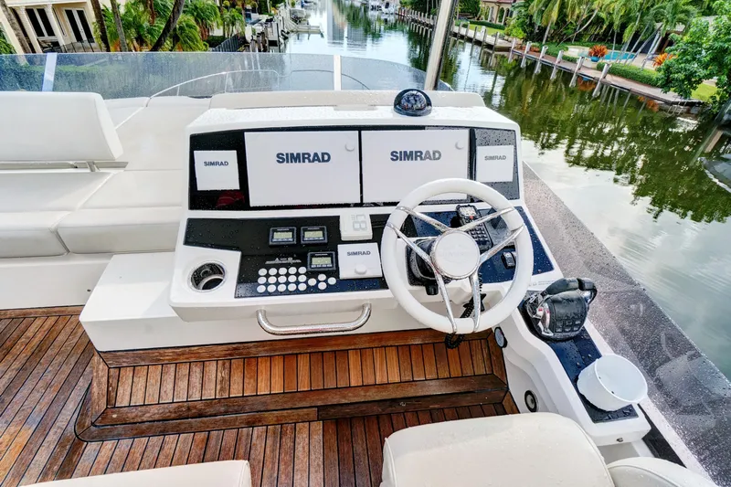 Joie De Vivre Yacht Photos Pics Cockpit of 2020 Sunseeker Manhattan 52 yacht with Simrad navigation system.