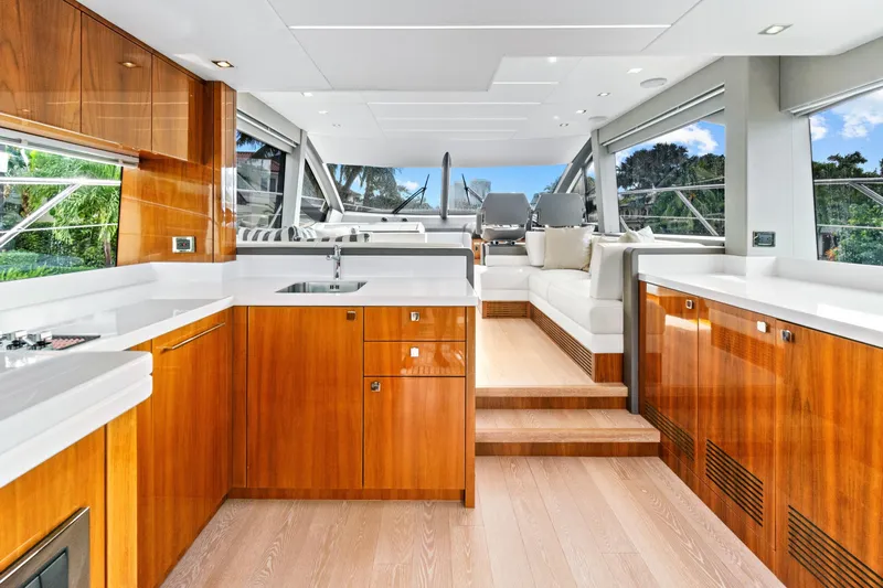Joie De Vivre Yacht Photos Pics Luxurious interior of 2020 Sunseeker Manhattan 52 yacht with sleek wood finishes and modern design.