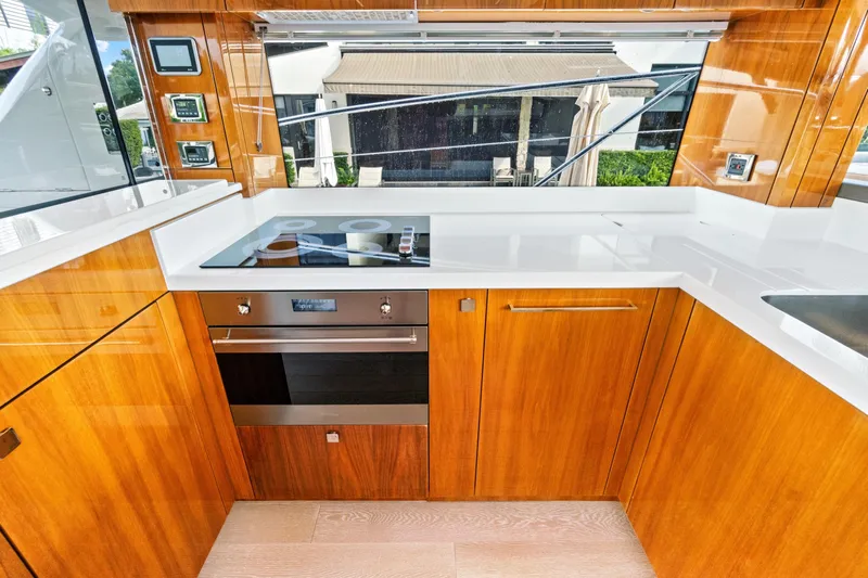 Joie De Vivre Yacht Photos Pics Luxurious kitchen interior of 2020 Sunseeker Manhattan 52 yacht with modern appliances.