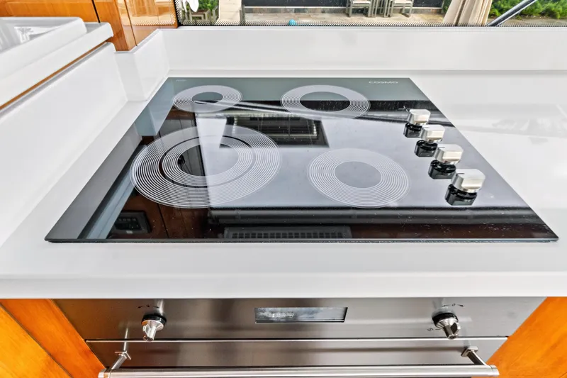 Joie De Vivre Yacht Photos Pics Modern stovetop in 2020 Sunseeker Manhattan 52 yacht kitchen.