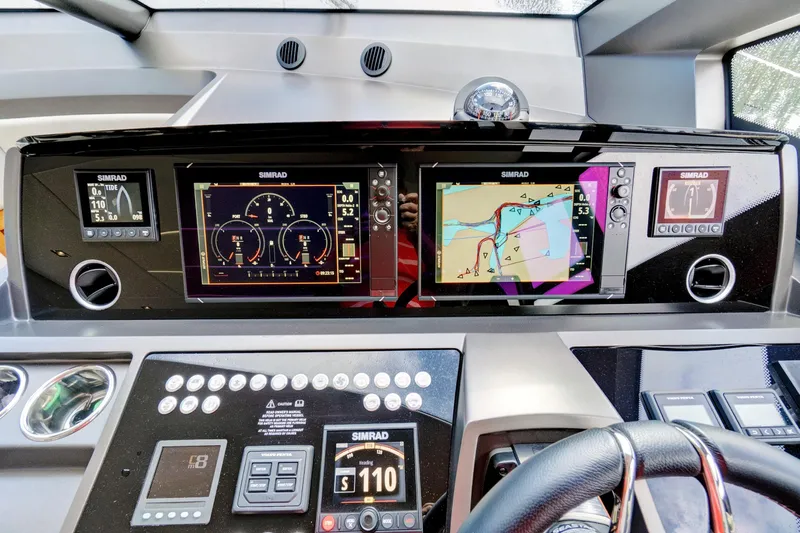 Joie De Vivre Yacht Photos Pics Dashboard of 2020 Sunseeker Manhattan 52 yacht with Simrad navigation displays.