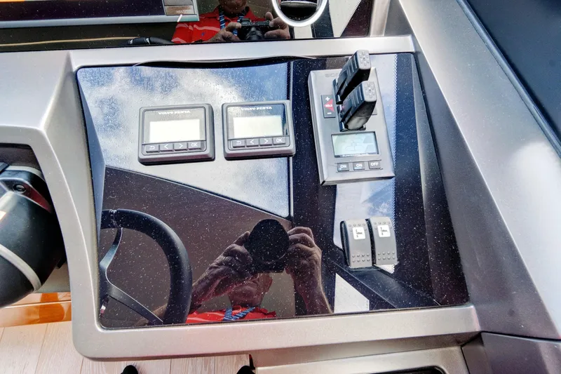 Joie De Vivre Yacht Photos Pics Control panel of a 2020 Sunseeker Manhattan 52 yacht with digital displays and switches.