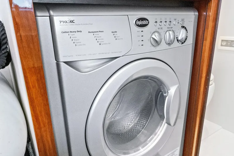Joie De Vivre Yacht Photos Pics Splendide washer-dryer unit on 2020 Sunseeker Manhattan 52 yacht, featuring multiple wash cycles.