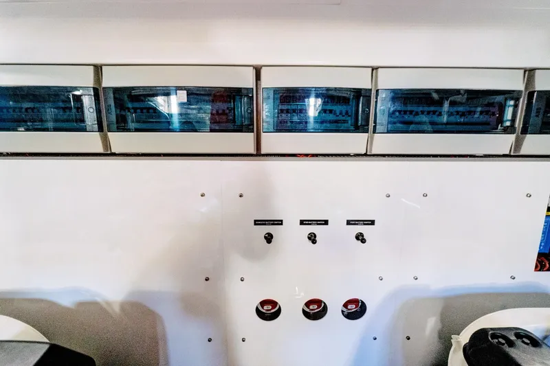 Joie De Vivre Yacht Photos Pics Electrical panel of a 2020 Sunseeker Manhattan 52 yacht, featuring switches and controls.