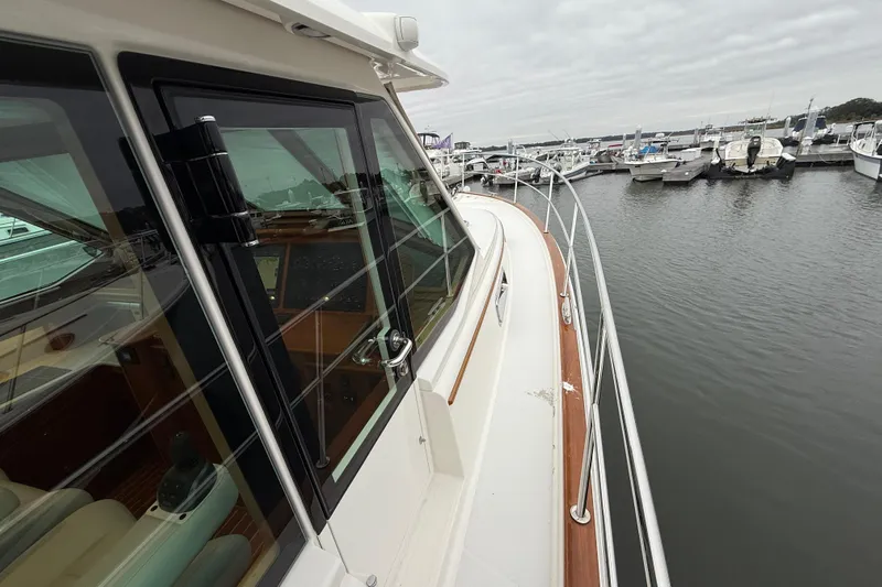 Kay Lee Jean Yacht Photos Pics 2023 Sabre 43 Salon Express yacht docked at marina, showcasing sleek design and luxurious features.