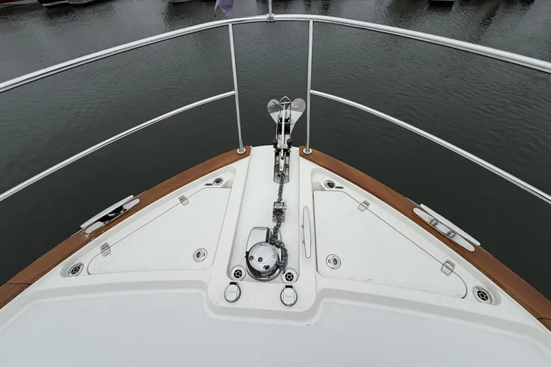 Kay Lee Jean Yacht Photos Pics Bow view of 2023 Sabre 43 Salon Express yacht with anchor and railing.